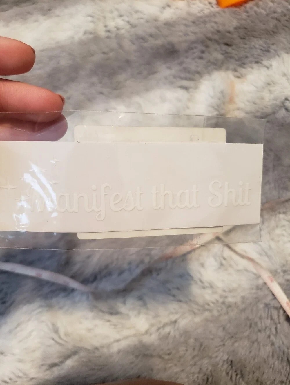 White Embossed ‘Manifest That Shi*’ Sticker 5″