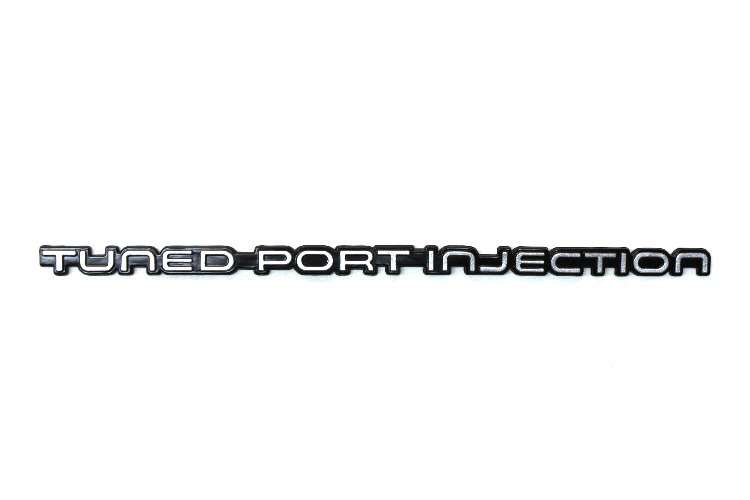 Camaro 82-92 “Tuned Port Injection” Rear Bumper Emblem, Silver, New Reproduction