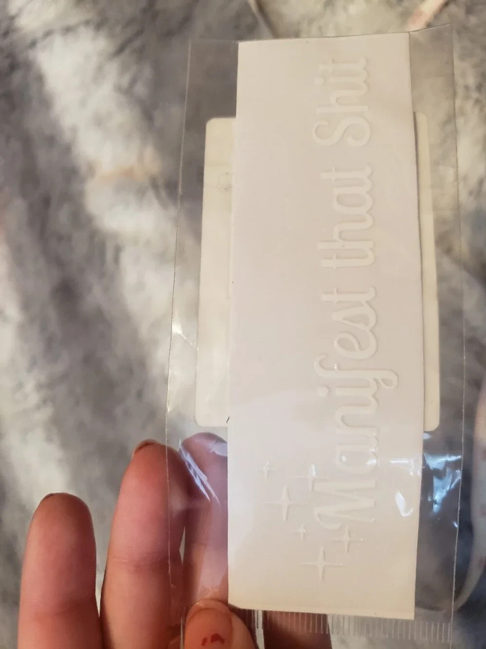 White Embossed ‘Manifest That Shi*’ Sticker 5″