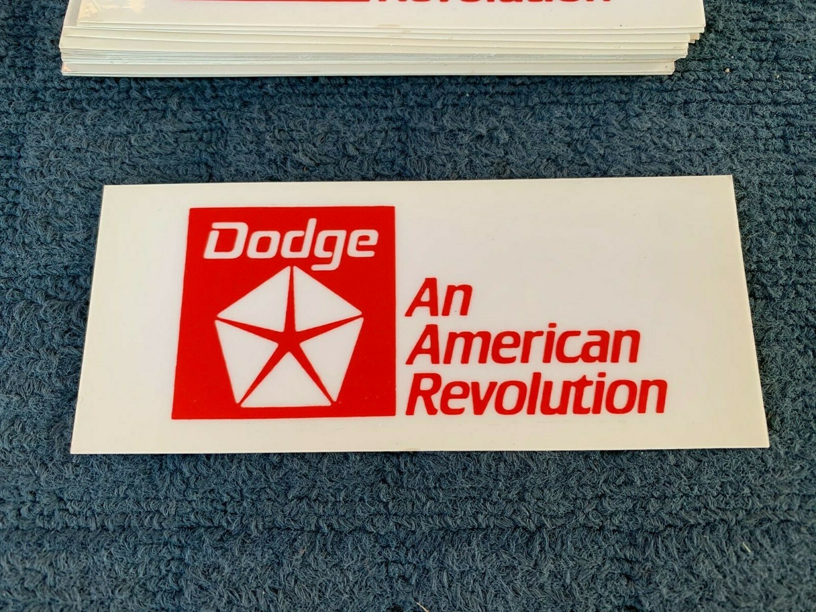 NOS DODGE An American Revolution 2.5″ x 6″ Red Print on Clear – Static Cling