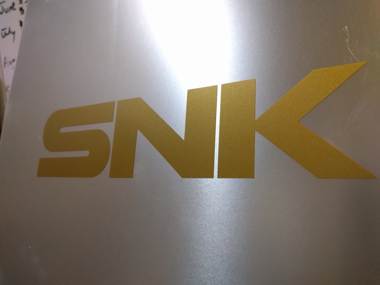 2 pack SNK text logo Vinyl sticker Gold Metallic 7 3/4″ x 1 3/4″ ( 200mm x 36mm)