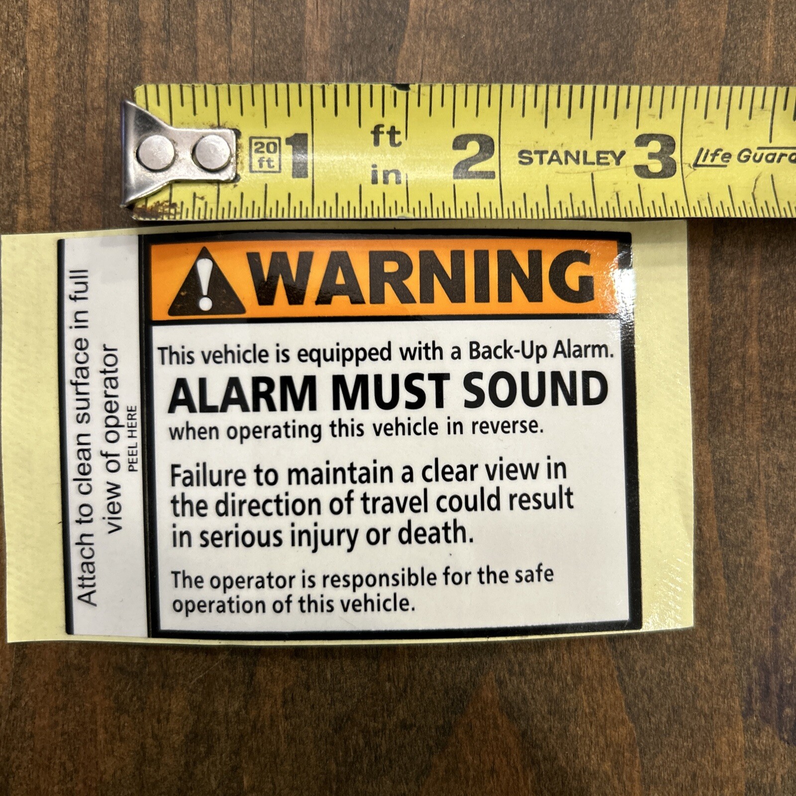 WARNING back-up alarm must sound vinyl decal. 2-3/4 x 2-1/4 inches.