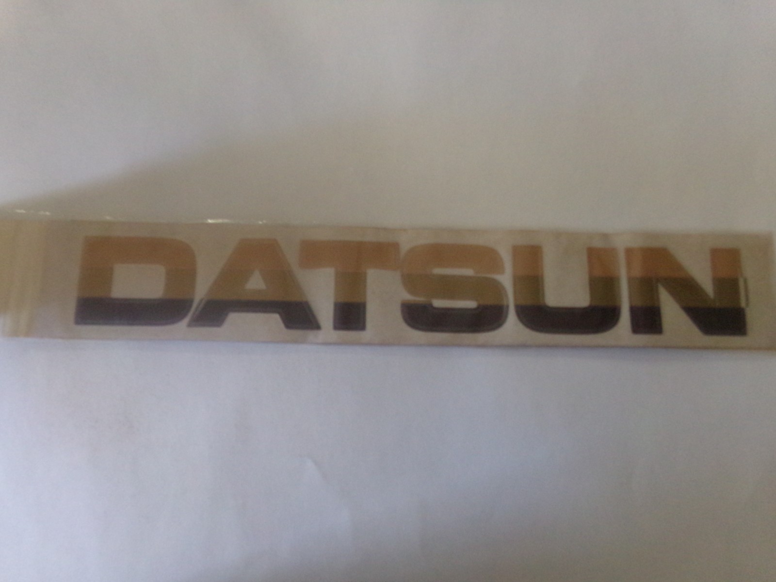 Vintage 1982 GILA Tri-Graphics Sticker Windshield DATSUN Multi Tone Brown NOS