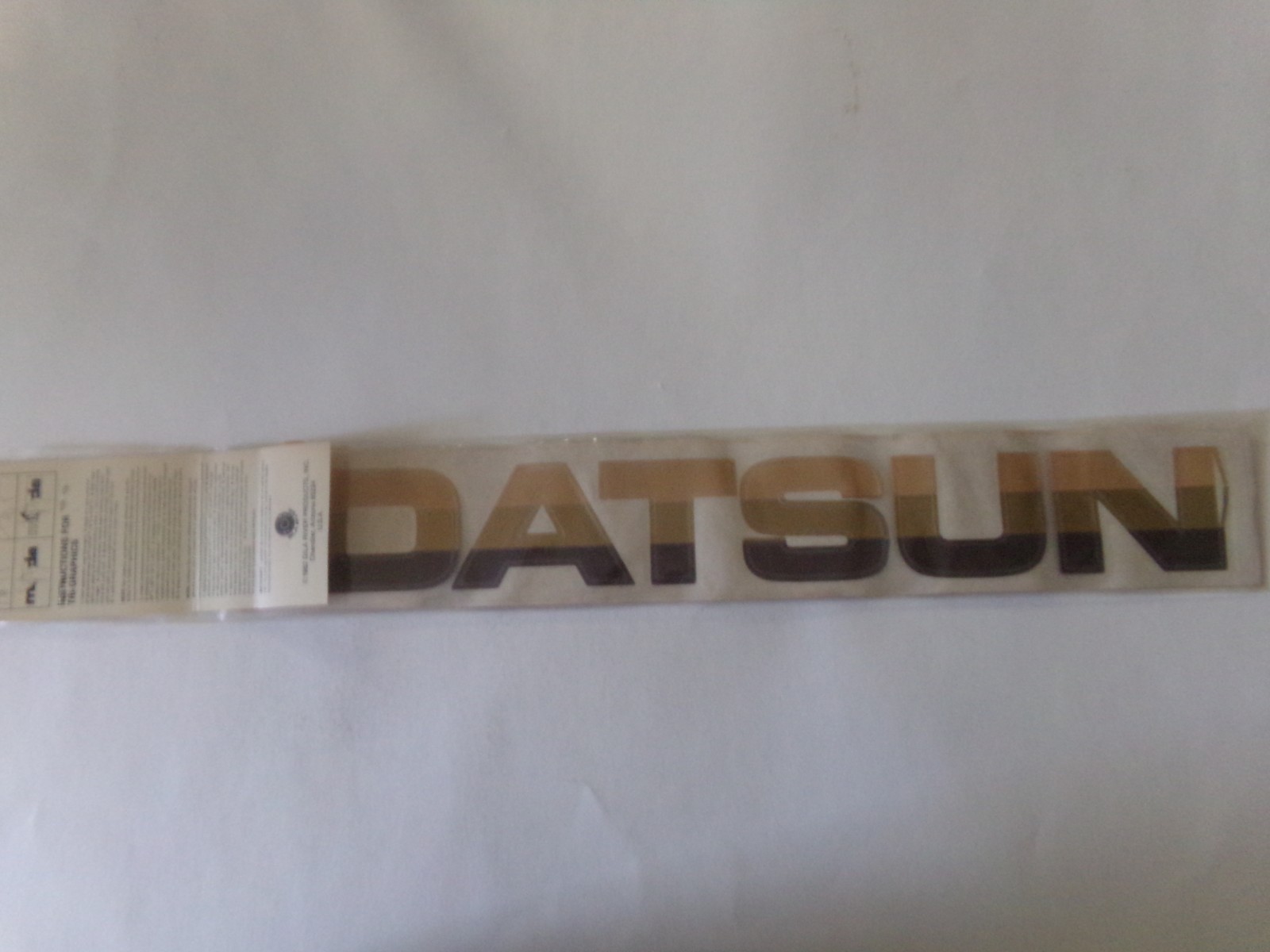 Vintage 1982 GILA Tri-Graphics Sticker Windshield DATSUN Multi Tone Brown NOS