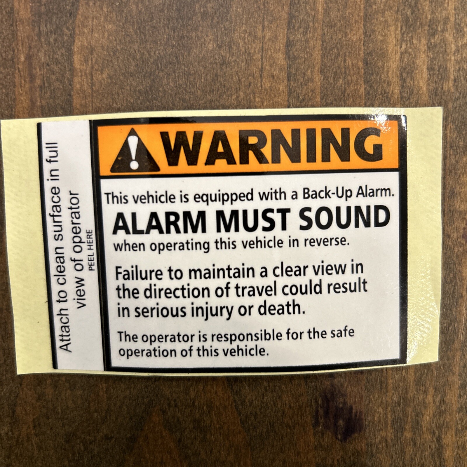 WARNING back-up alarm must sound vinyl decal. 2-3/4 x 2-1/4 inches.